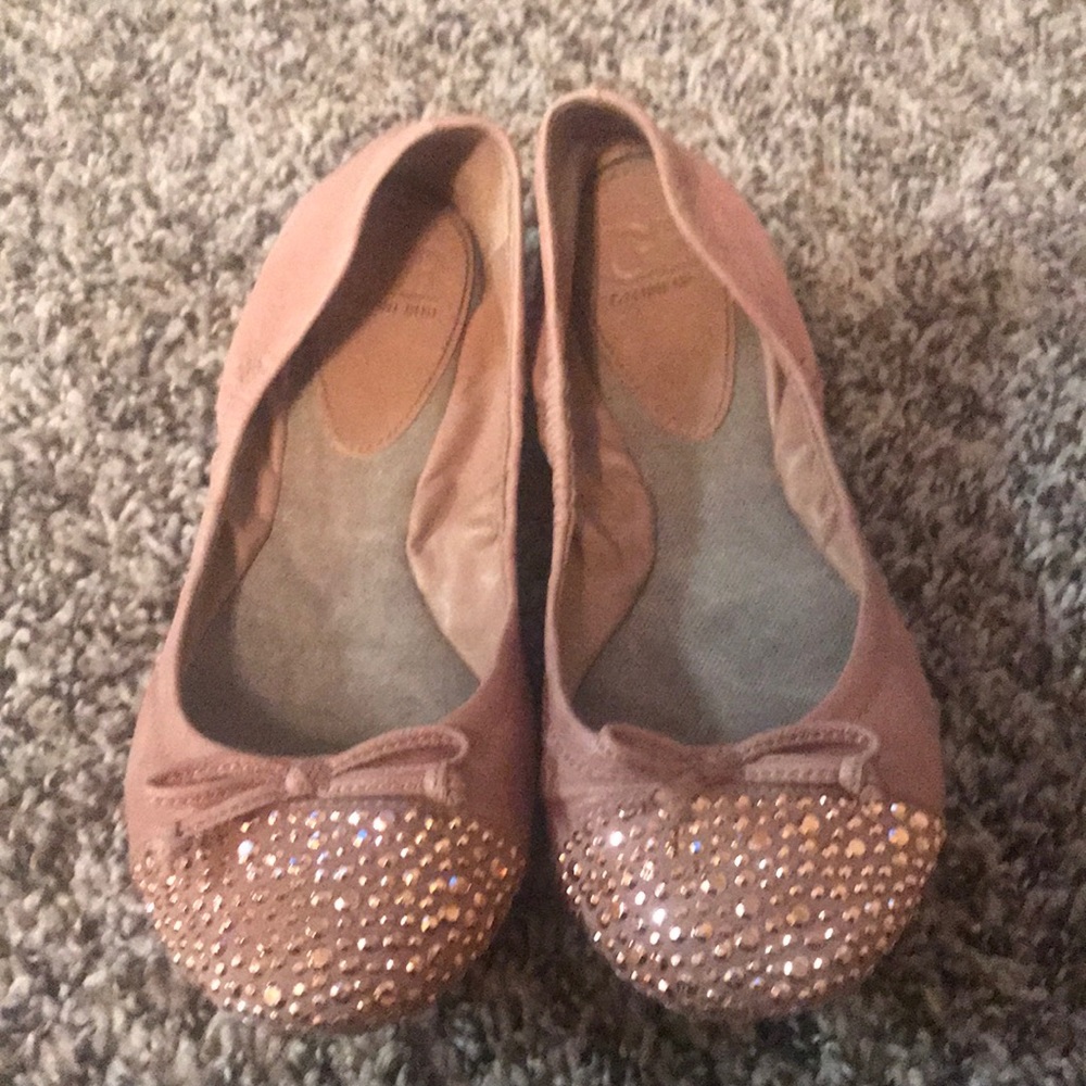 Nude pink flats.